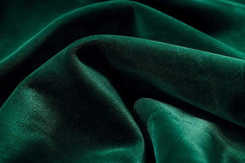 rich emerald green velvet upholstery fabric close-up texture
